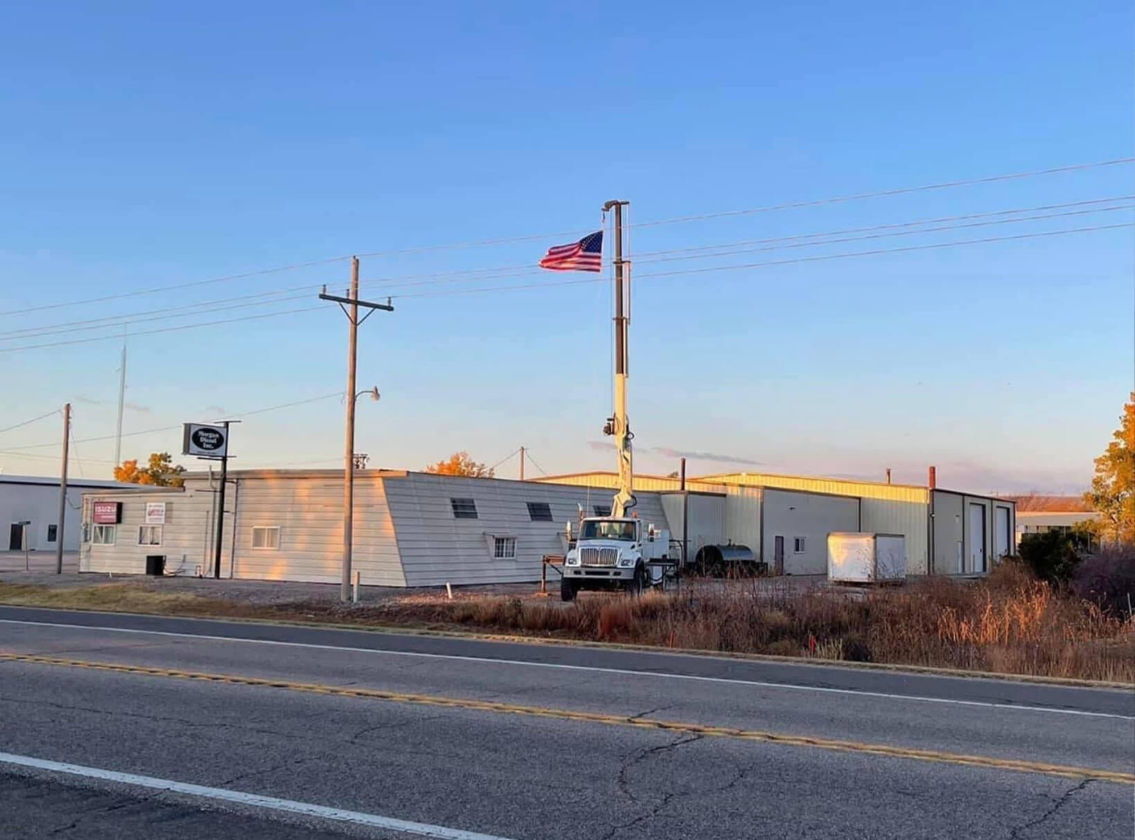 Morgan Diesel Storefront with American Flag & Service Truck